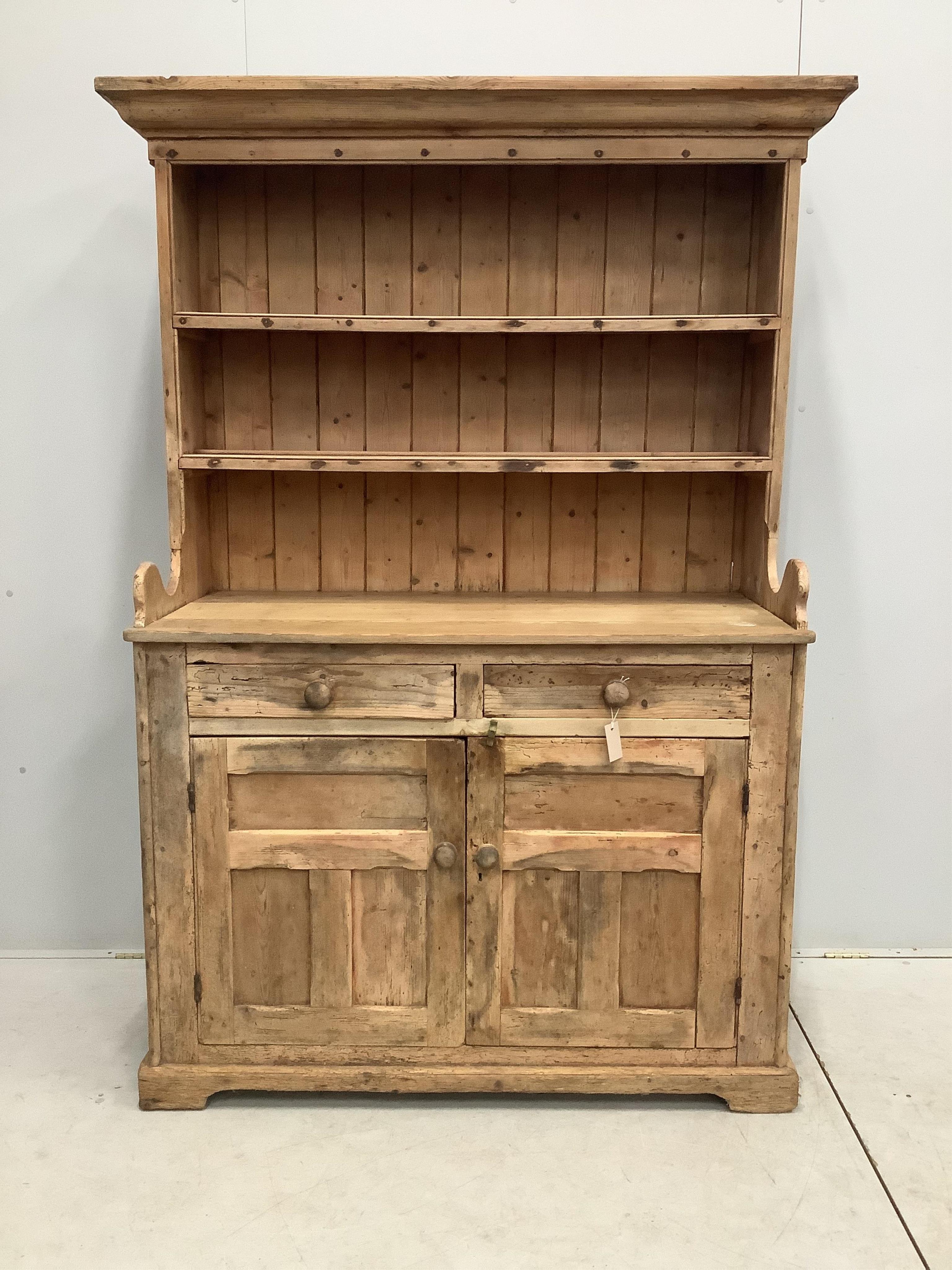 A 19th century Irish pine dresser with boarded rack, width 124cm, 51cm, height 122cm. Condition - fair